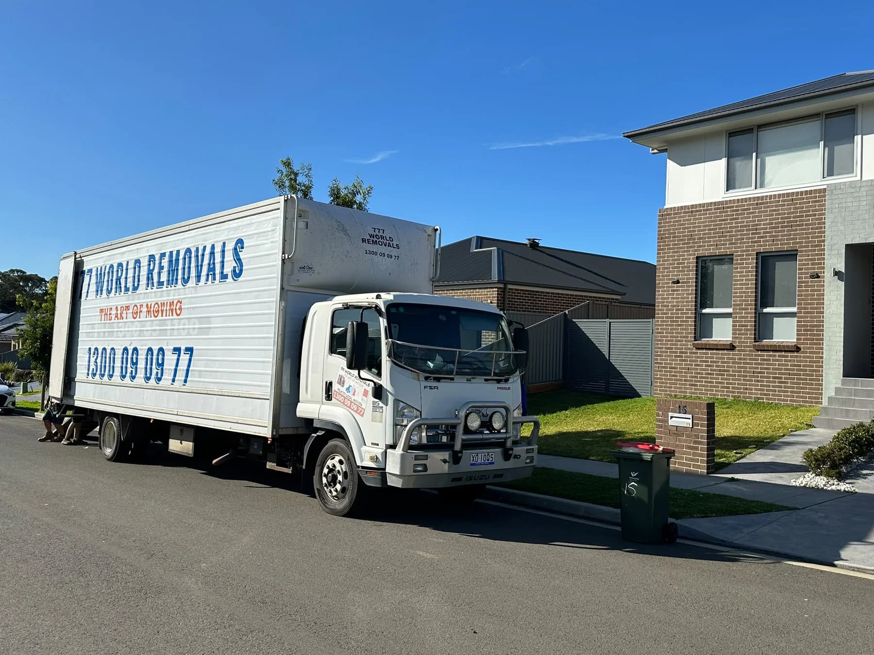 777 World Removals truck outside a local family home